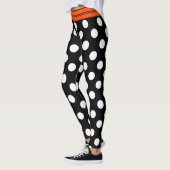 Schwarze u. weiße Retro Tupfen mit orange Streifen Leggings (Links)
