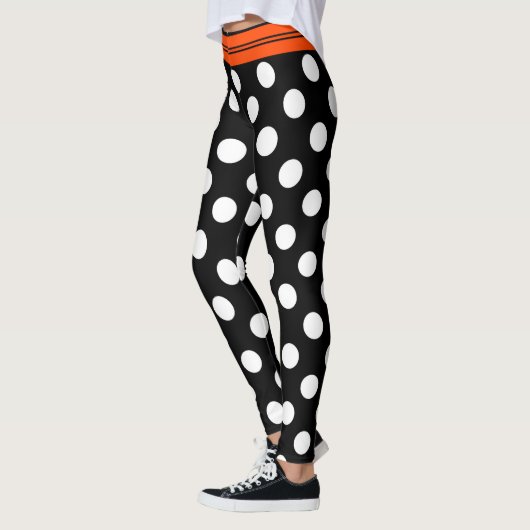 Schwarze u. weiße Retro Tupfen mit orange Streifen Leggings (Links)