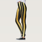 Schwarze und goldene Streifen Leggings (Links)