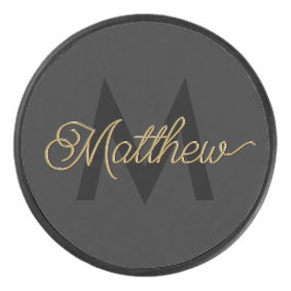 Schwarze und goldene Typografie Hinzufügen von Nam Eishockey Puck