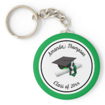 Schwarze und grüne Graduierungskappe und Tassel