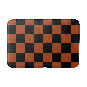 Schwarze und orange karierte Quadrate Büffelkaromu Badematte