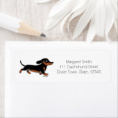 Schwarze und Tan-Dackel laufen (Insitu)