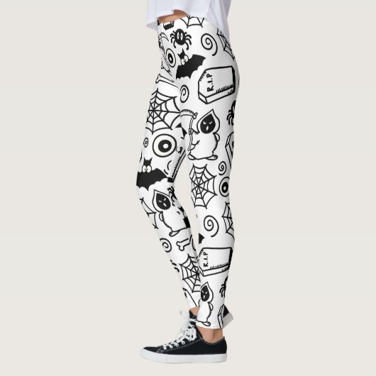 SCHWARZE UND WEISSE HALLOWEEN DOODLES LEGGINGS (Links)