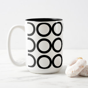 Schwarze und weiße kreisgeometrische zweifarbige tasse