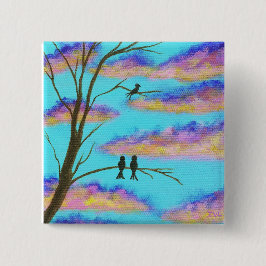 Schwarze Vögel auf Ast-bunter Wolken-Himmel-Kunst Button