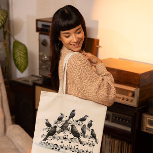 Schwarze Vögel auf einer musikalischen Komposition Tragetasche