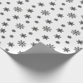 Schwarze Weihnachtsschneeflocken im weißen Hinterg Geschenkpapier (Ecke)
