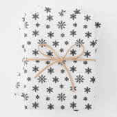 Schwarze Weihnachtsschneeflocken im weißen Hinterg Geschenkpapier Set (Beispiel)