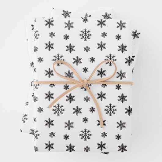 Schwarze Weihnachtsschneeflocken im weißen Hinterg Geschenkpapier Set (Beispiel)