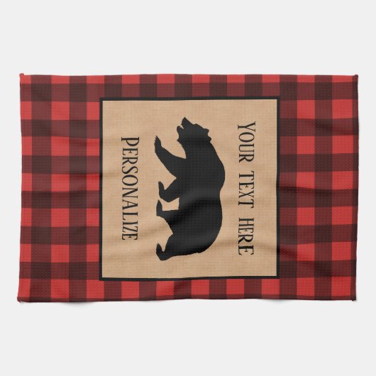 Schwarzer Bär auf einem roten und schwarzen Karier Geschirrtuch (Horizontal)