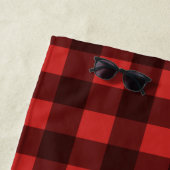 Schwarzer Bär auf einem roten und schwarzen Karier Strandtuch (Beispiel)