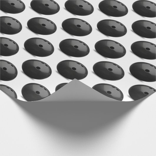 Schwarzer Bowlingball auf Weiß Geschenkpapier (Ecke)