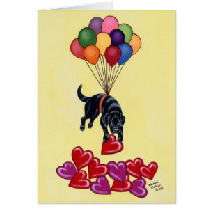 Schwarzer Labrador und Herzen