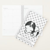 Schwarzer Parti-Color-Spitz-Hund und benutzerdefin Planer (Anzeige)