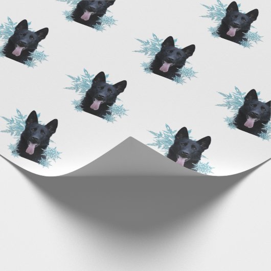 Schwarzer Schäfer in den Schneeflocken Geschenkpapier (Ecke)