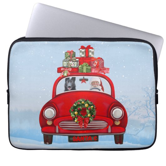 Schwarzer Schäferhund in Auto mit dem Weihnachtsma Laptopschutzhülle (Vorderseite)