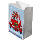 Schwarzer Schäferhund in Auto mit dem Weihnachtsma Mittlere Geschenktüte (Rückseite Schrägansicht)