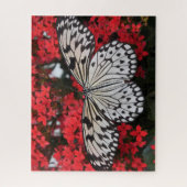 Schwarzer Schmetterling in der Roten Blume Bush Puzzle (Vertikal)
