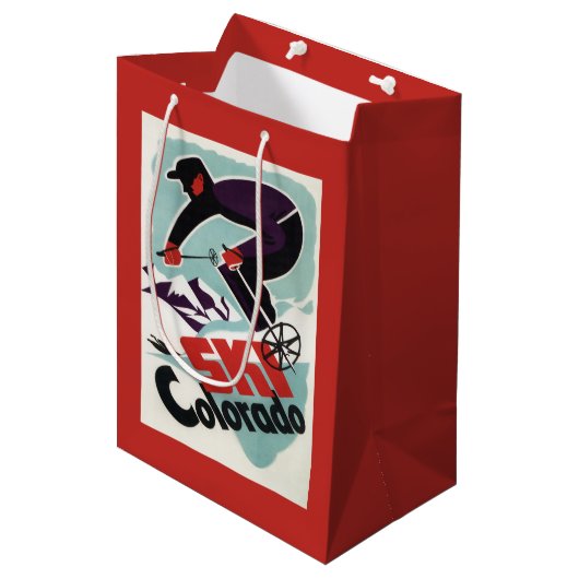 Schwarzer und lila gekleideter Skier Mittlere Geschenktüte (Vorderseite Schrägansicht)
