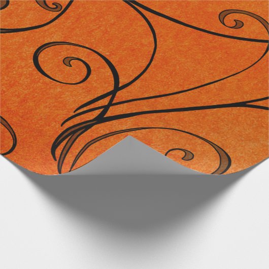 Schwarzer Wirbel auf orange Geschenkpapier (Ecke)