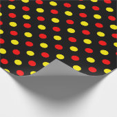 Schwarzes Design mit roten und gelben Tupfen Geschenkpapier (Ecke)