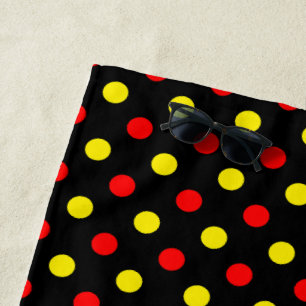Schwarzes Design mit roten und gelben Tupfen Strandtuch