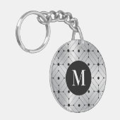 Schwarzes geometrisches Muster silbermetallischer  Schlüsselanhänger (Vorderseite links)