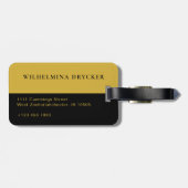 Schwarzes Gepäckanhänger mit goldenem M und indivi (Rückseite horizontal)