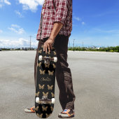 Schwarzes Goldbutterfliegenmuster Skateboard