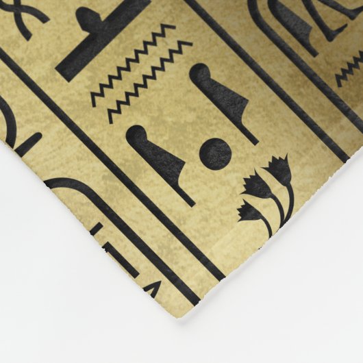 Schwarzes Hieroglyphenmuster auf altem Gold Fleecedecke (Ecke)