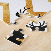 Schwarzes Hirsch, goldenes Muster. Puzzle (Seite)