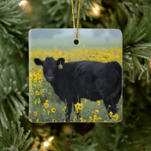 Schwarzes Kalb auf einem Feld mit Sonnenblumen Keramikornament