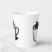 Schwarzes Kätzchen mit roter Nase, das sich in ein Pappbecher (Links)