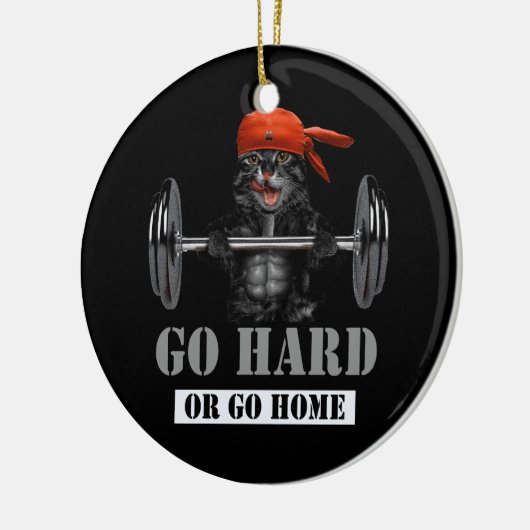 Schwarzes Katzengewicht in Fitness Gym wird schwer Keramik Ornament (Links)