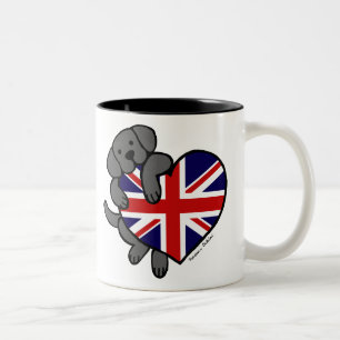 Schwarzes Labrador u. Cartoon des Zweifarbige Tasse