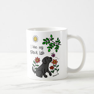 Schwarzes Labrador und grüne Tasse