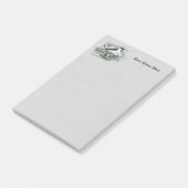 Schwarzes mit einer Kappe bedecktes Post-it Klebezettel (angewinkelt)