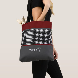 Schwarzes Muster mit Burgund Tasche