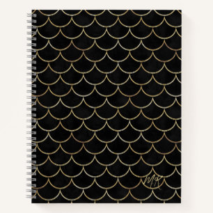 Schwarzes Notizbuch mit goldenen Schuppen und Mono