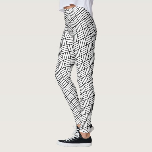 Schwarzes u. weißes winkliges Luken-Muster Leggings (Links)