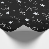 schwarzes Umhüllungspapier mit Sonderzeichen und S Geschenkpapier (Ecke)