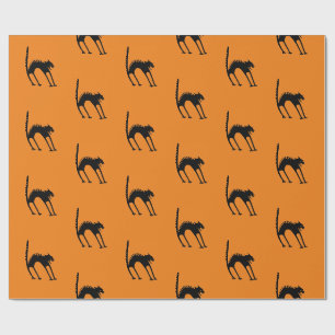 SCHWARZKRAFTKATZE MIT ORANGE GESCHENKPAPIER