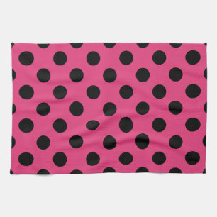 Schwarzpolka-Punkte auf Fuchsia Handtuch