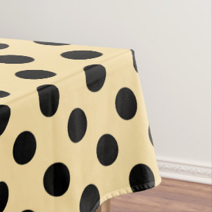 Schwarzpolka-Punkte auf hellgelb Tischdecke