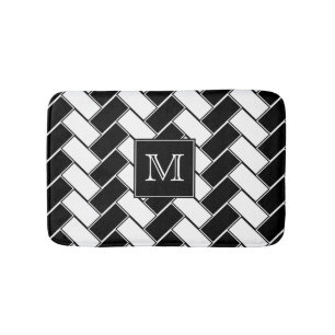 Schwarzweiss-Fischgrätenmuster mit Monogramm Badematte
