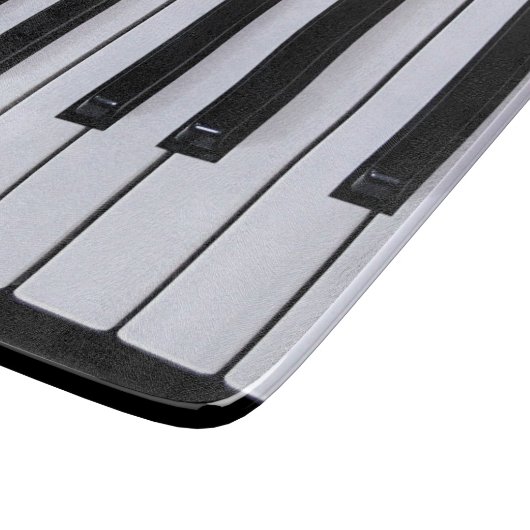 Schwarzweiss-Klavier befestigt Schneidebrett (Ecke)