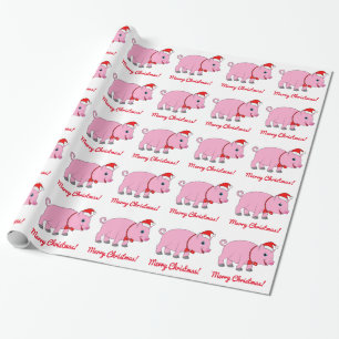 Schwein mit einer Weihnachtsmannmütze und einem Geschenkpapier