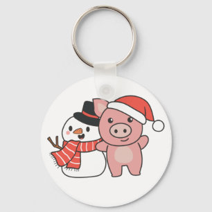 Schweinefleisch mit Schneemann im Winter zu Weihna Schlüsselanhänger