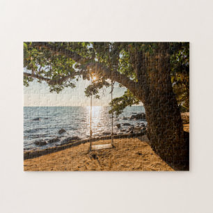 Schwingen auf dem Strand am Sonnenuntergang Puzzle